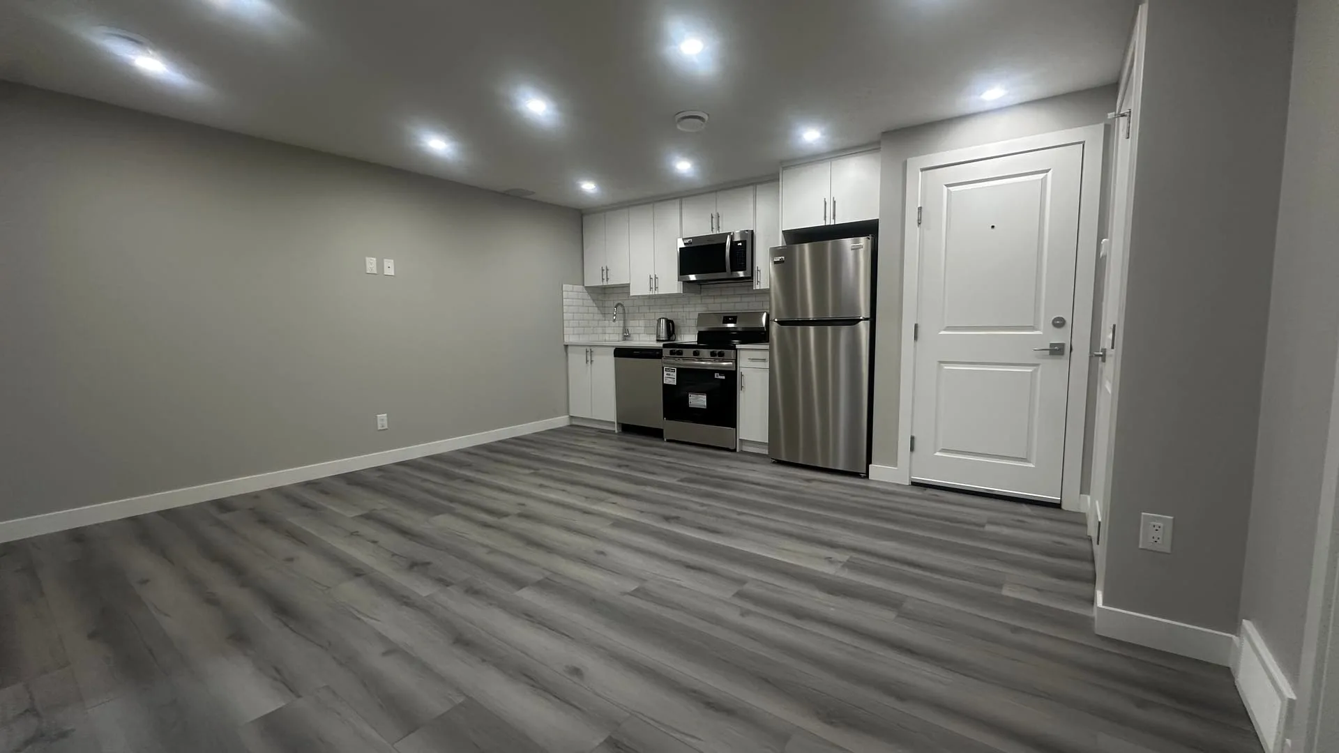 White cabinetry legal suite kitchen completed by OAF Construction